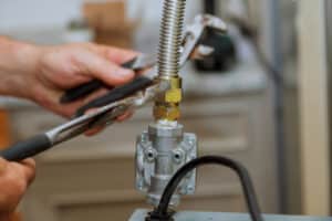 Gas line inspection by a licensed technician.