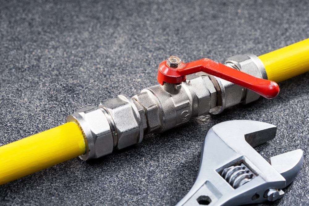 Gas,Tap,Connected,To,Yellow,Gas,Pipe,And,Wrench.,Concept