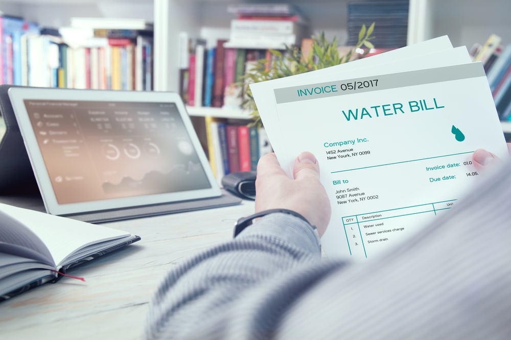 Man,Holds,Invoice,Of,Water,Usage